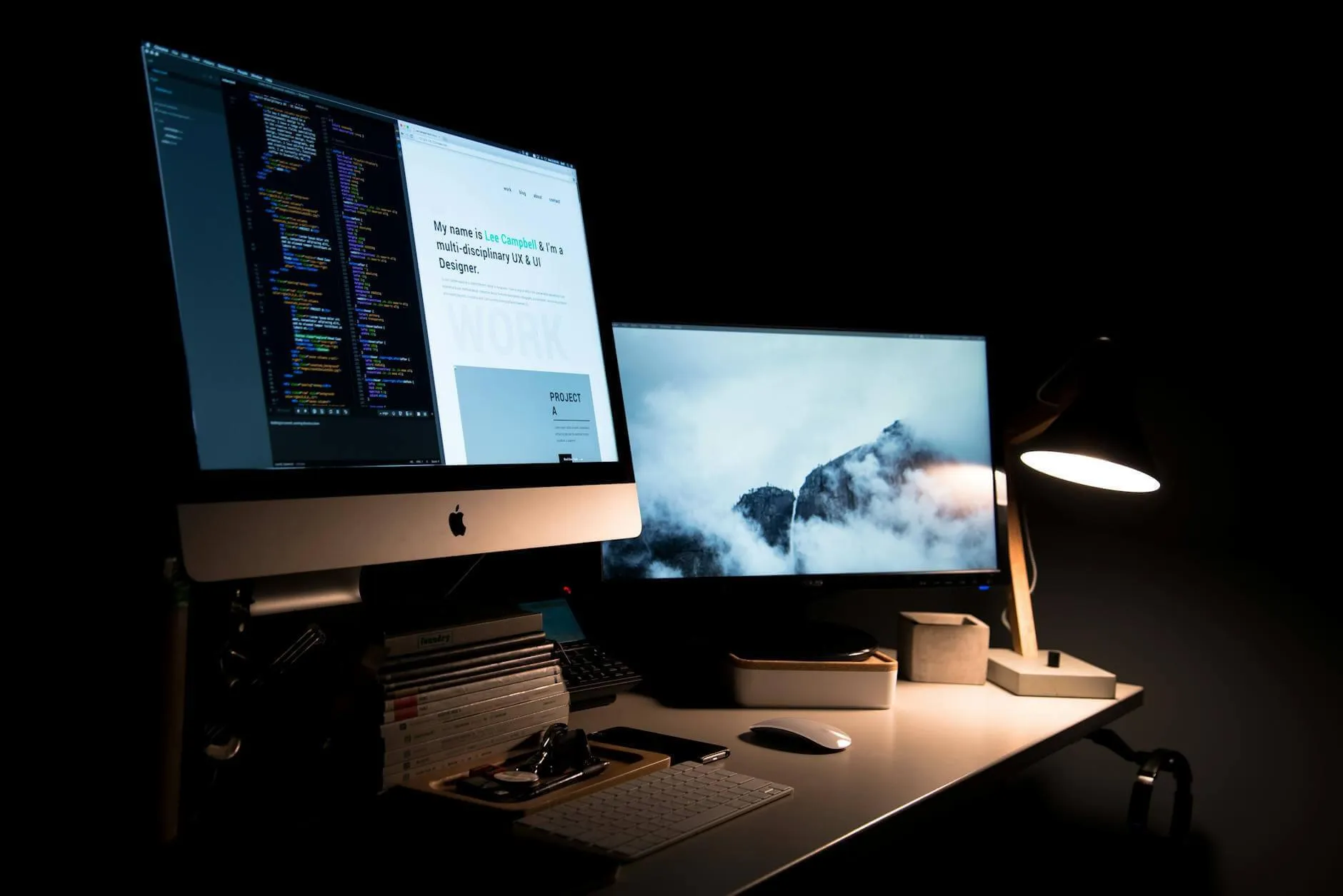 Desktop computer showing code in a dark room