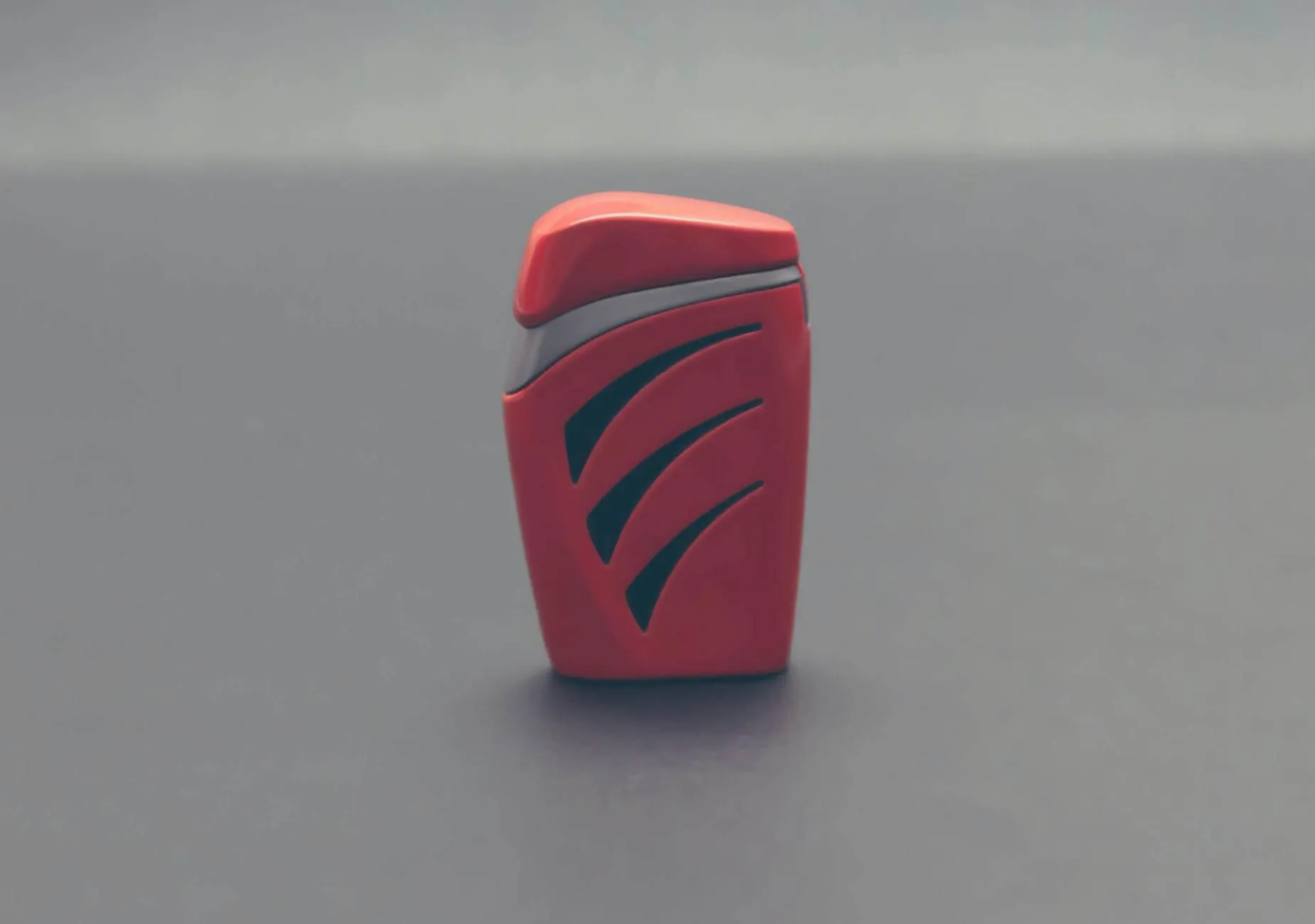Red product standing alone on a grey surface